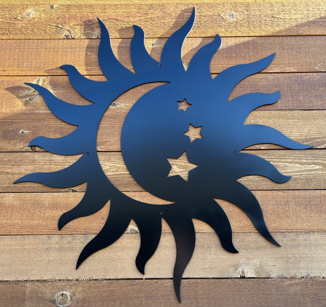 Blue metal moon and stars wall art on wood siding.